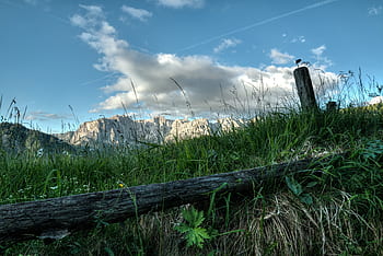hd-wallpaper-mountains-clouds-sky-meadow-fence-royalty-free-thumbnail.jpg