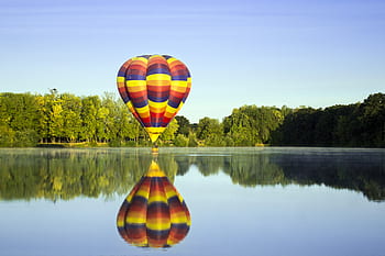 hot-air-balloon-lake-reflection-nature-outdoors-activity-royalty-free-thumbnail.jpg