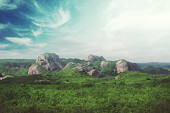 green-grass-field-rocks-boulders-landscape-royalty-free-thumbnail.jpg
