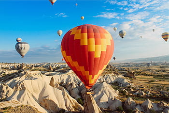 hot-air-balloons-rocks-cliffs-valleys-royalty-free-thumbnail.jpg