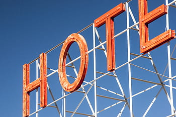 hotel-sign-letters-orange-blue-sky-royalty-free-thumbnail.jpg